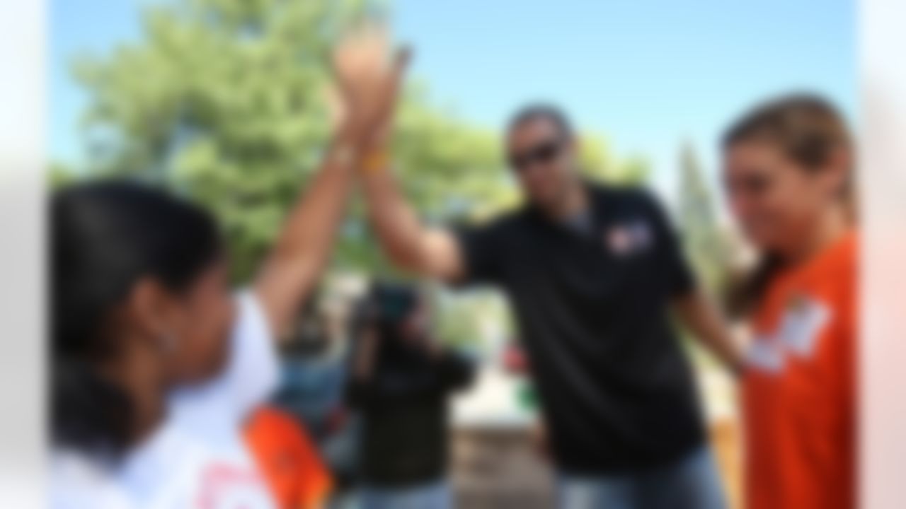 Mike Furrey and Claudia Logan celebrate after completing a project for the new playground. (Photo by Tom Copeland/Home Depot)
