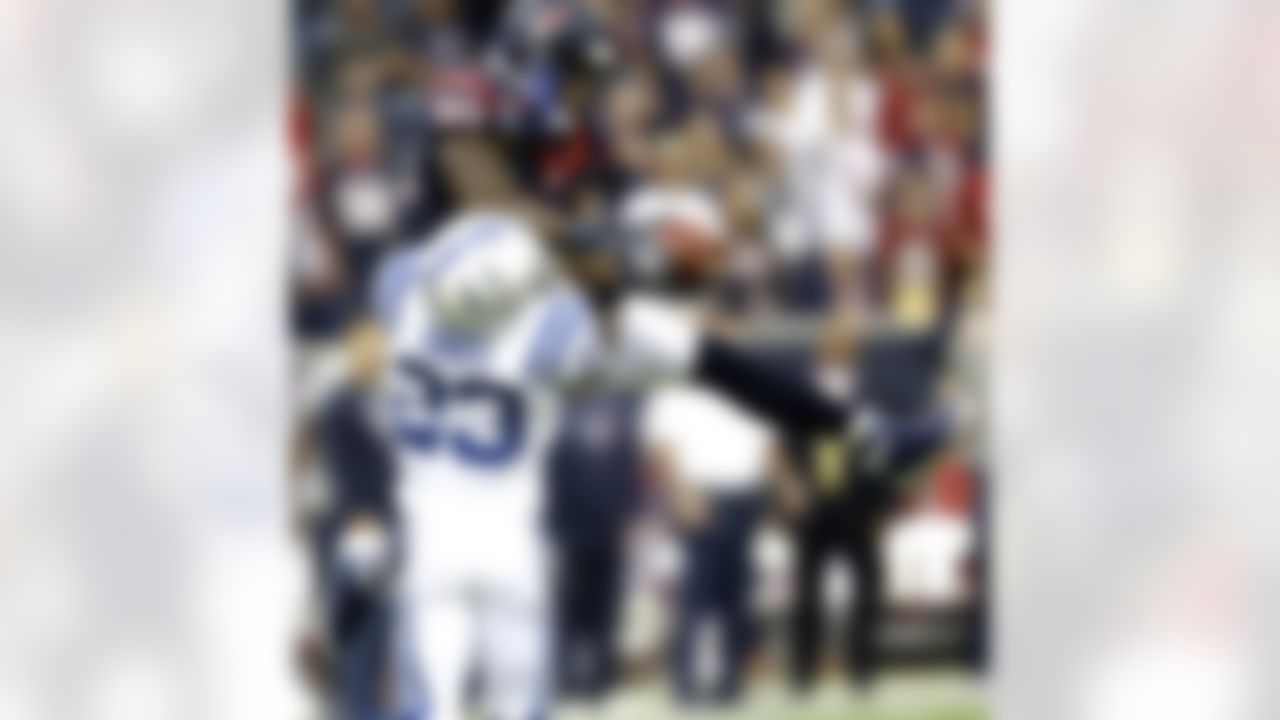 Houston Texans wide receiver Andre Johnson (80) catches a pass for a first down as Indianapolis Colts cornerback Vontae Davis (23) defends in the first quarter of an NFL football game Sunday, Dec. 16, 2012, in Houston. (AP Photo/Eric Gay)