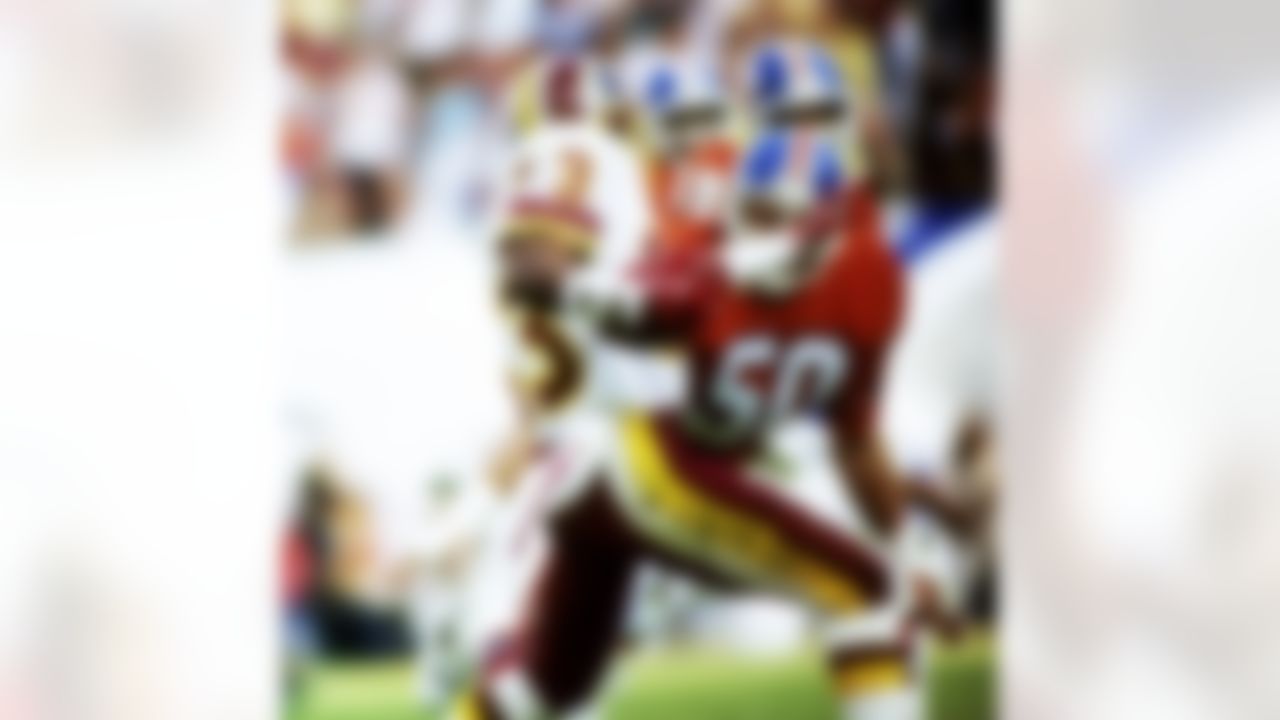 Denver Broncos linebacker Jim Ryan (50) has the angle on Washington Redskins wide receiver Ricky Sanders (83) during Super Bowl XXII, a 42-10 Redskins victory on January 31, 1988, at Jack Murphy Stadium in San Diego, CA. (National Football League)