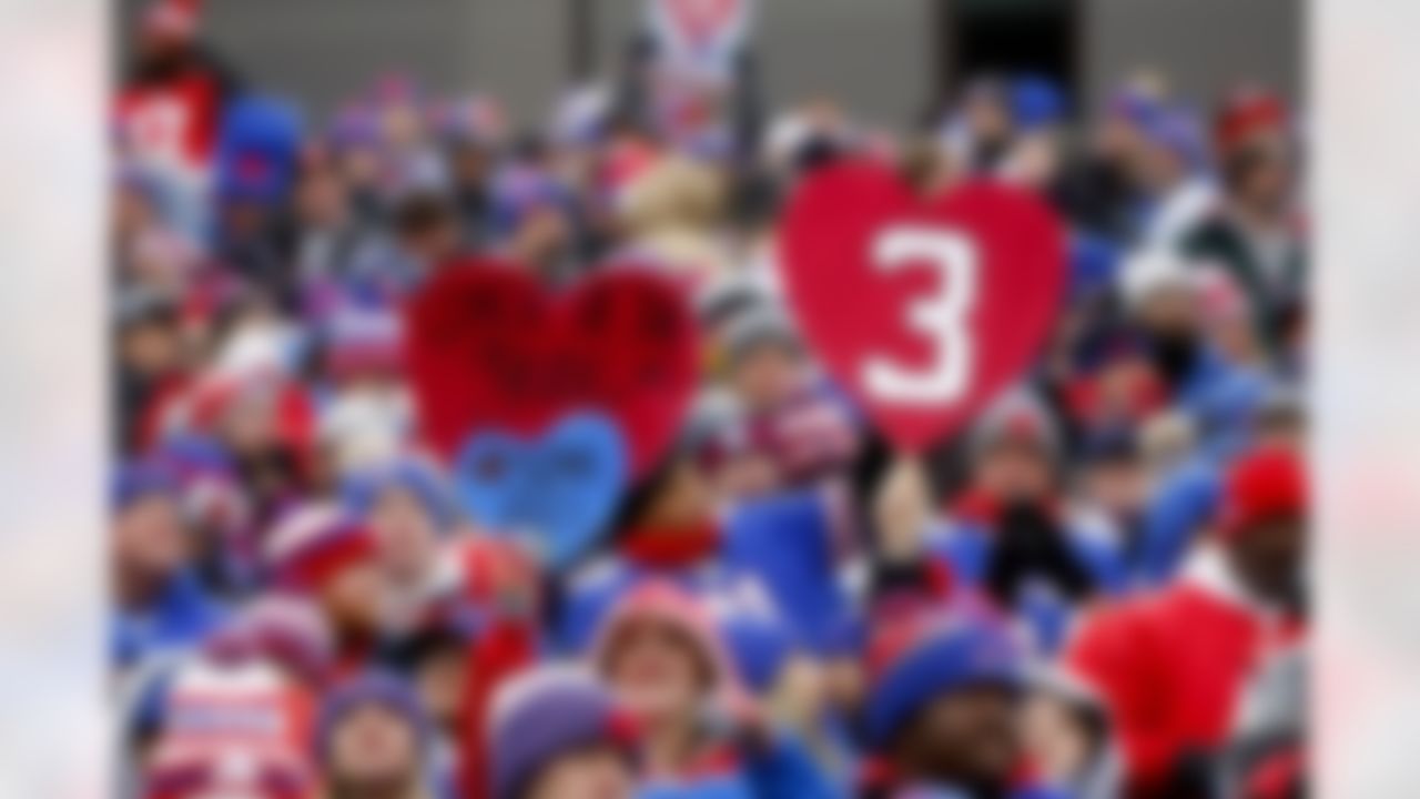 Fans hold up signs in support of Buffalo Bills safety Damar Hamlin during the first half of an NFL football game against the New England Patriots, Sunday, Jan. 8, 2023, in Orchard Park. Hamlin remains hospitalized after suffering a catastrophic on-field collapse in the team's previous game against the Cincinnati Bengals.