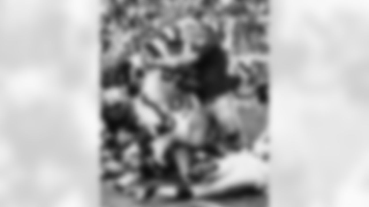 Henry Dyer of Los Angeles Rams ploughs through the line for a three-yard gain in their game with Detroit Lions at Los Angeles Coliseum, on Nov. 3, 1968. Bringing Dyer down in Lions Alex Karras (71). (AP Photo)