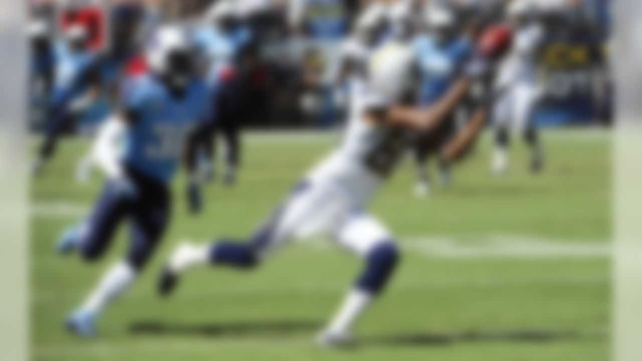 San Diego Chargers wide receiver Malcom Floyd, right, makes a catch as Tennessee Titans cornerback Jason McCourty, left, cannot catch up during the first quarter of an NFL football game on Sunday, Sept. 16, 2012, in San Diego. (AP Photo/Denis Poroy)