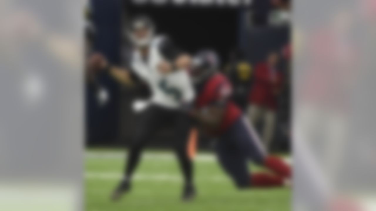 Jacksonville Jaguars quarterback Blake Bortles (5) is pulled down by Houston Texans defensive end Antonio Smith (94) during the second half of an NFL football game Sunday, Dec. 18, 2016, in Houston. (AP Photo/Eric Christian Smith)