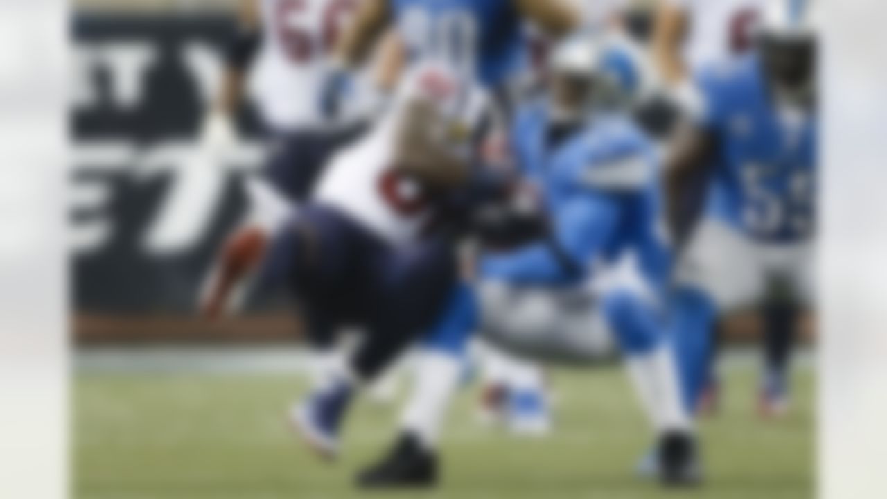 Detroit Lions cornerback Chris Houston (23) intercepts a pass intended for Houston Texans wide receiver Andre Johnson (80) in overtime of an NFL football game at Ford Field in Detroit, Thursday, Nov. 22, 2012. Houston defeated Detroit 34-31 in overtime. (AP Photo/Rick Osentoski)