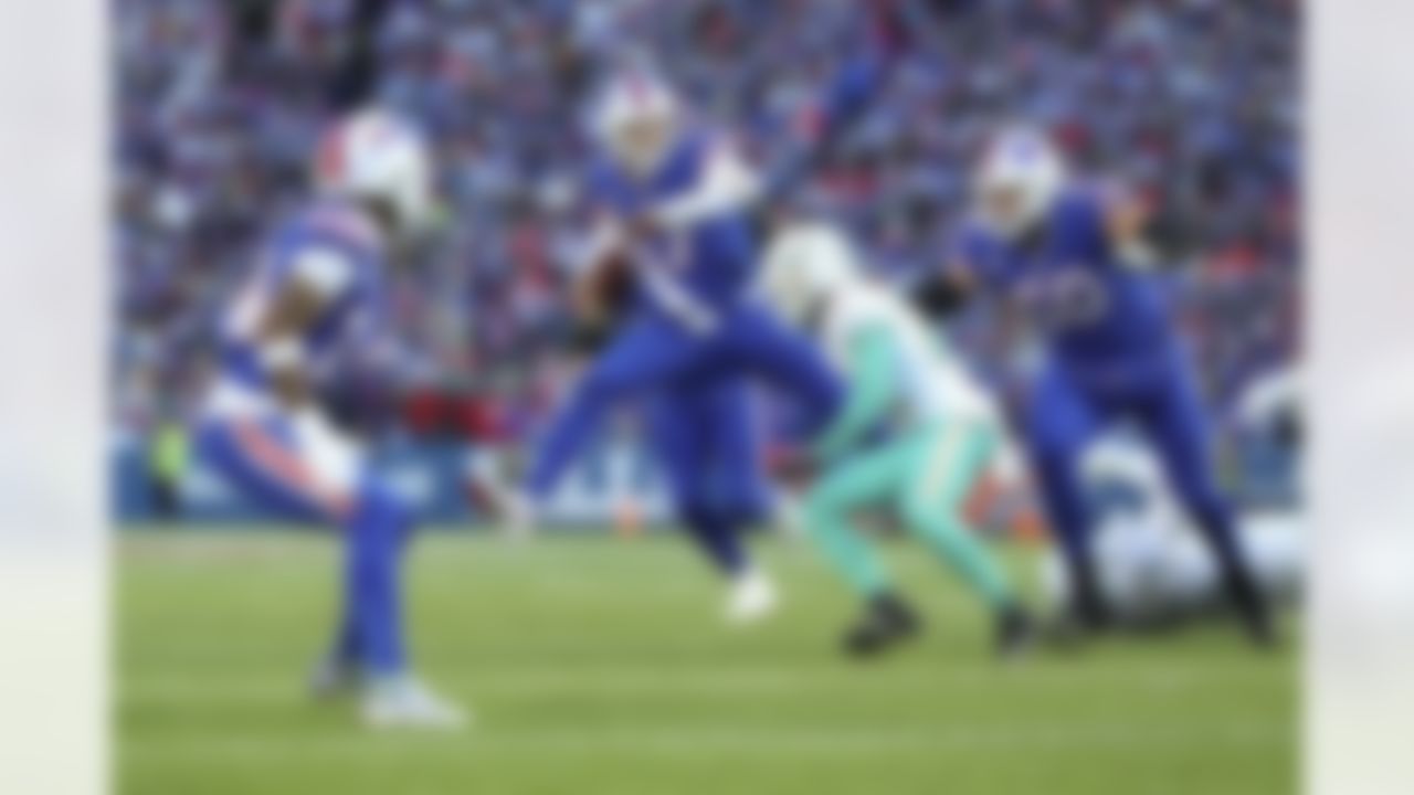 Buffalo Bills quarterback Josh Allen (17) runs the ball during an NFL Super Wild Card Weekend playoff game against the Miami Dolphins on Sunday, January 15, 2023 in Orchard Park, New York.