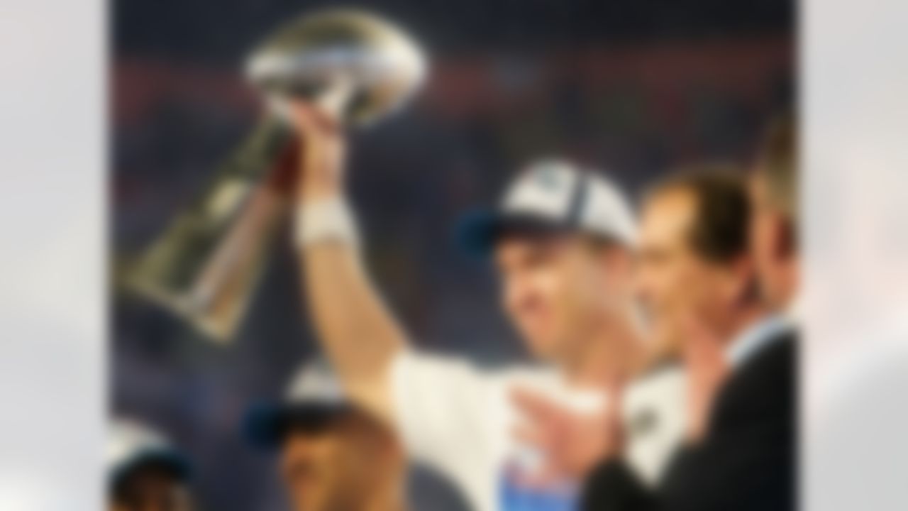 MIAMI GARDENS, FL - FEBRUARY 04: Quarterback Peyton Manning #18 of the Indianapolis Colts celebrates with the Vince Lombardi Super Bowl trophy after winning the Super Bowl XLI 29-17 over the Chicago Bears on February 4, 2007 at Dolphin Stadium in Miami Gardens, Florida. (Photo by Jed Jacobsohn/Getty Images)