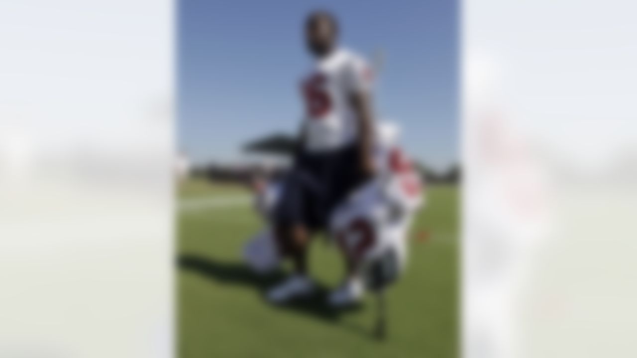 Houston Texans rookie wide receiver Trindon Holliday carries the pads and helmets of team veterans after a NFL football training camp practice Monday, Aug. 2, 2010 in Houston. (AP Photo/David J. Phillip)