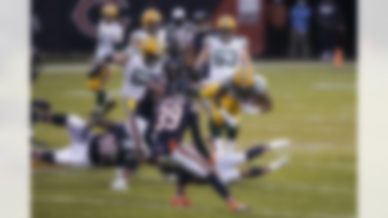 Green Bay Packers running back Aaron Jones (33) runs the ball during an NFL football game against the Chicago Bears on Sunday, January 3, 2021 in Chicago, Illinois.