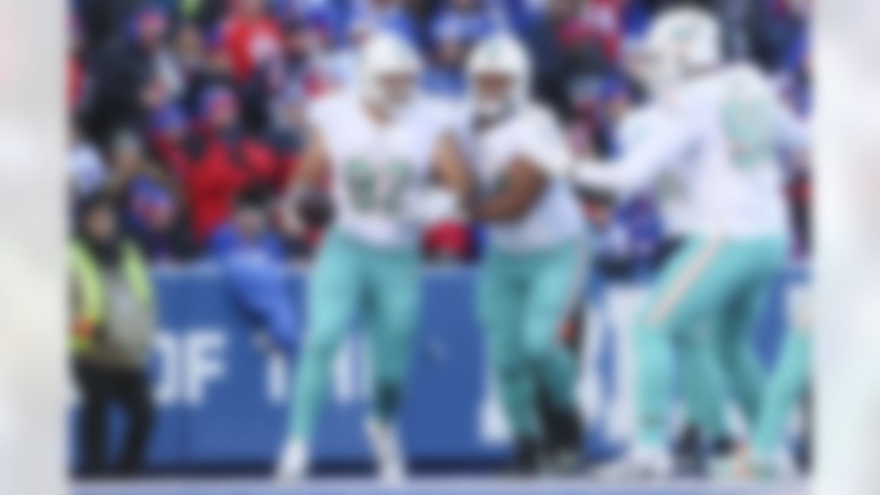 Miami Dolphins defensive tackle Zach Sieler (92) celebrates after scoring a touchdown during an NFL Super Wild Card Weekend playoff game against the Buffalo Bills on Sunday, January 15, 2023 in Orchard Park, New York.