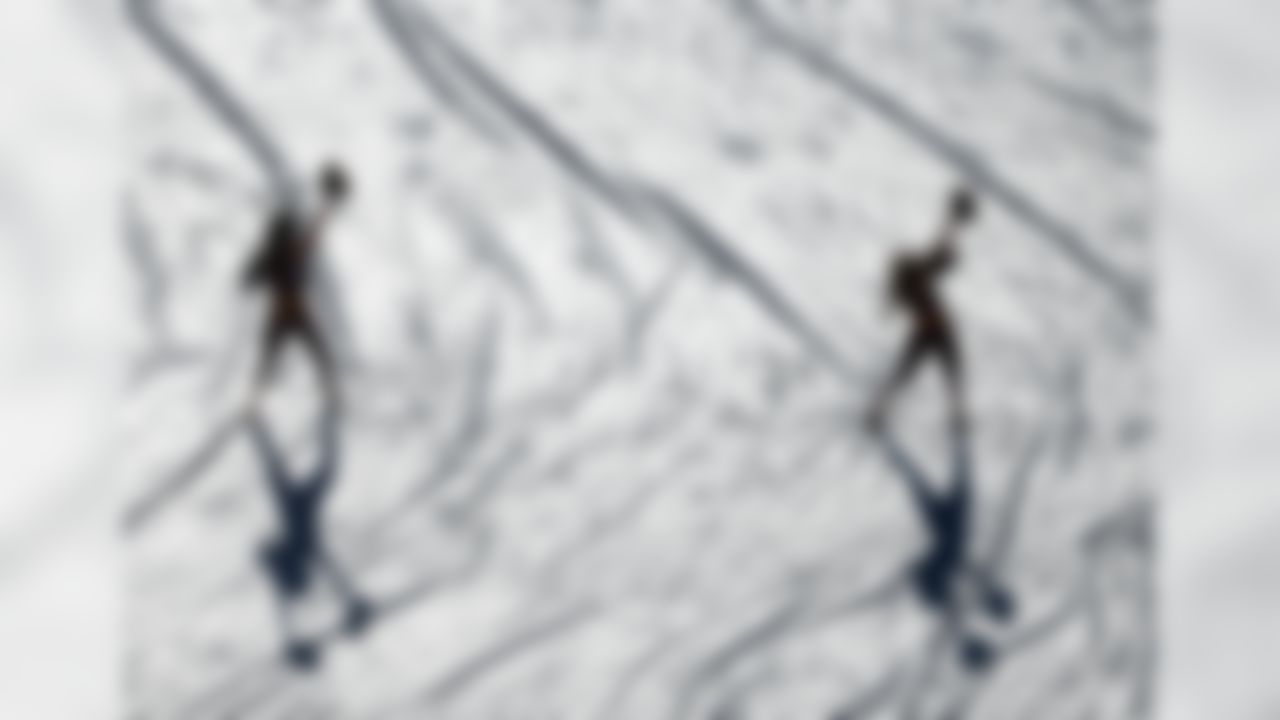 Members of the Washington Redskins Cheerleaders practice their routines on the tarp-covered field before an NFL football game against the Miami Dolphins, Sunday, Sept. 13, 2015, in Landover, Md. (AP Photo/Evan Vucci)