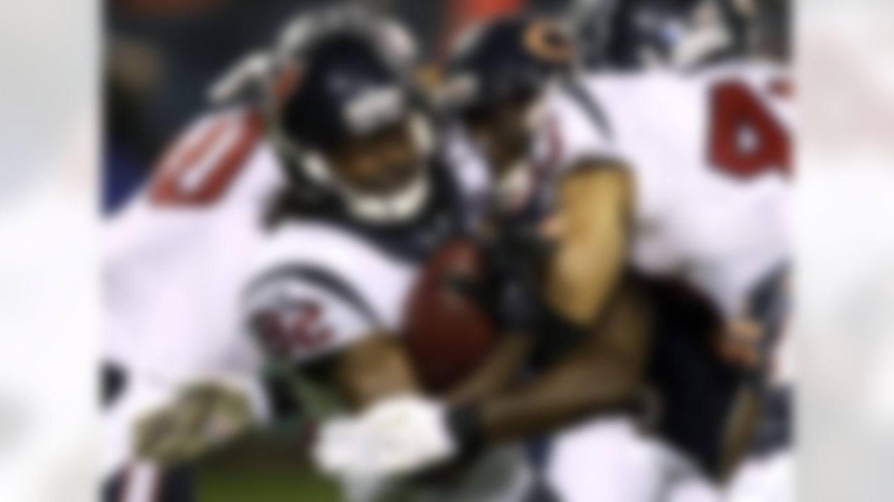 Houston Texans wide receiver Keshawn Martin (82) is tackled by Chicago Bears defensive back Zack Bowman during the first half of an NFL football game, Sunday, Nov. 11, 2012, in Chicago. (AP Photo/Nam Y. Huh)