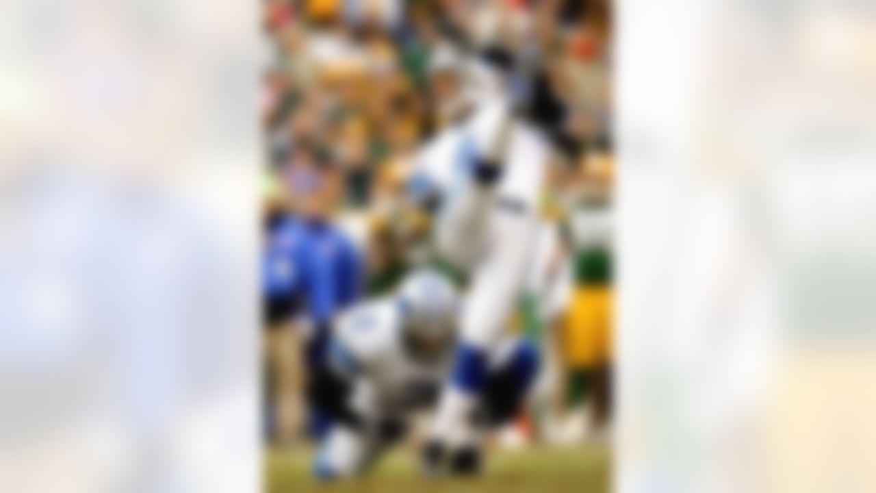 GREEN BAY, WI - DECEMBER 17: Nick Harrris #2 of the Detroit Lions holds as Jason Hanson #4 kicks a field goal against the Green Bay Packers at Lambeau Field December 17, 2006 in Green Bay, Wisconsin. Photo by Getty Images.