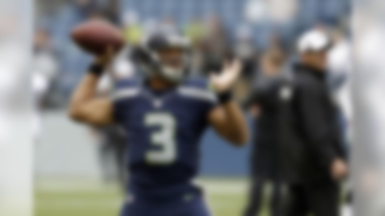 Seattle Seahawks quarterback Russell Wilson throws during warmups before an NFL preseason football game against the Oakland Raiders, Thursday, Aug. 29, 2013, in Seattle. (AP Photo/Elaine Thompson)