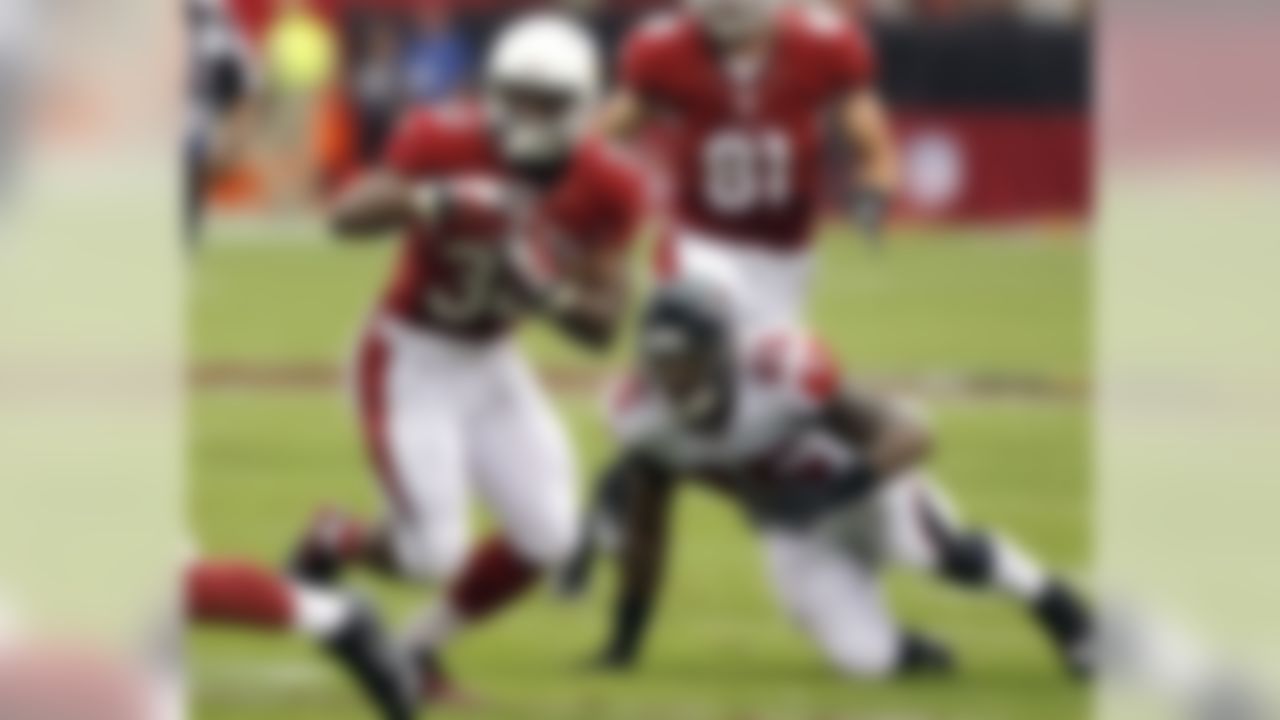 Arizona Cardinals running back Stepfan Taylor, left, runs as Atlanta Falcons strong safety William Moore (25) defends during the first half of an NFL football game Sunday, Oct. 27, 2013, in Glendale, Ariz. (AP Photo/Rick Scuteri)