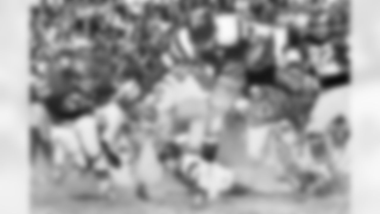 Washington Redskins rookie halfback Charley Taylor (42) carries the football during the Redskins 21-10 victory over the Philadelphia Eagles on November 1, 1964 at Franklin Field in Philadelphia, Pennsylvania. Taylor was named NFL Rookie of the Year. (National Football League)