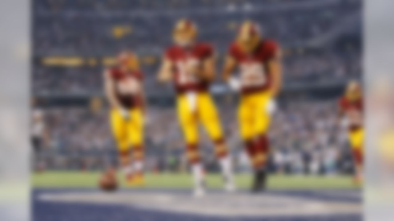 Washington Redskins quarterback Colt McCoy (16) celebrates his touchdown run during the NFL game against the Dallas Cowboys on Monday, Oct. 27, 2014 at AT&T Stadium in Arlington, TX. (Ric Tapia/NFL)