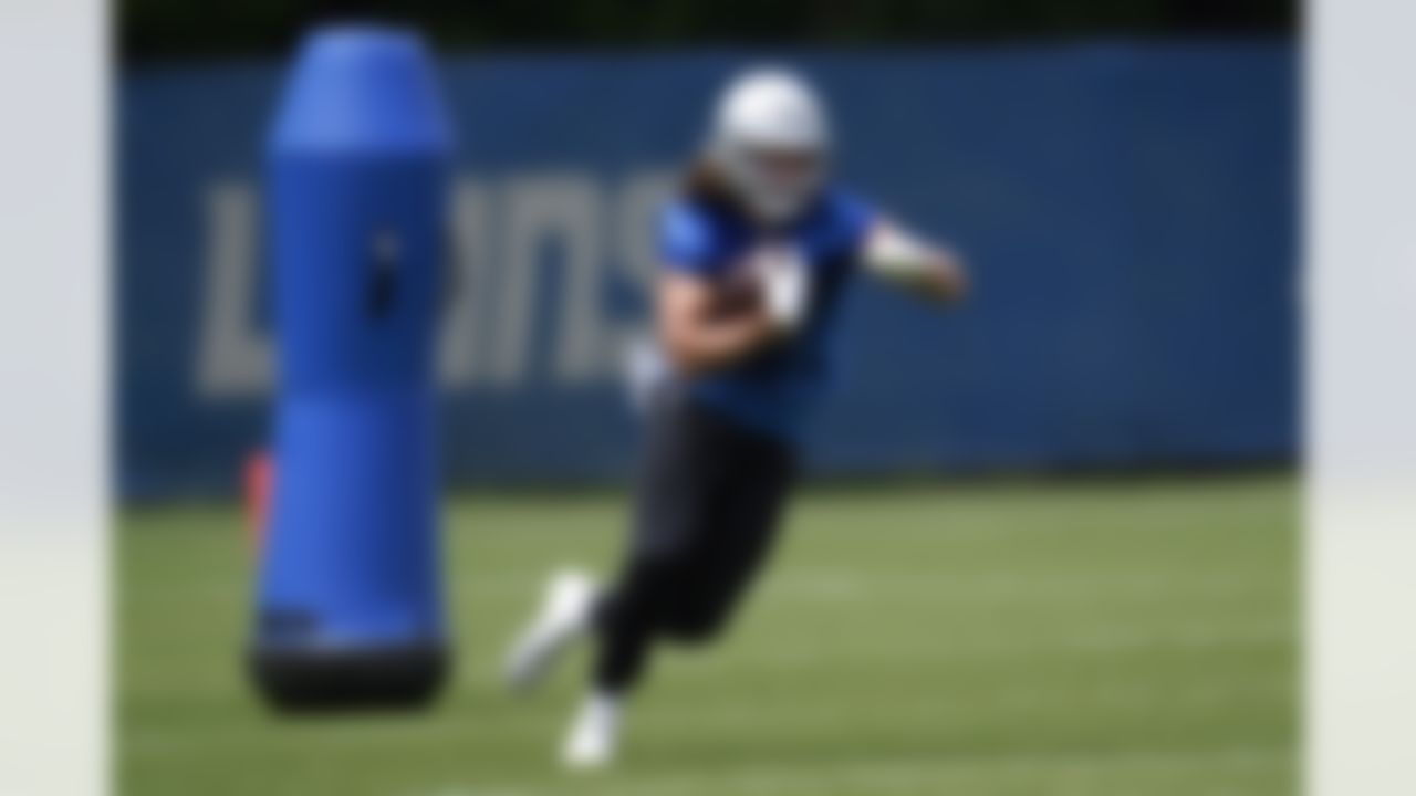 Detroit Lions tight end T.J. Hockenson runs after a catch during NFL football practice in Allen Park, Mich., Thursday, June 3, 2021.