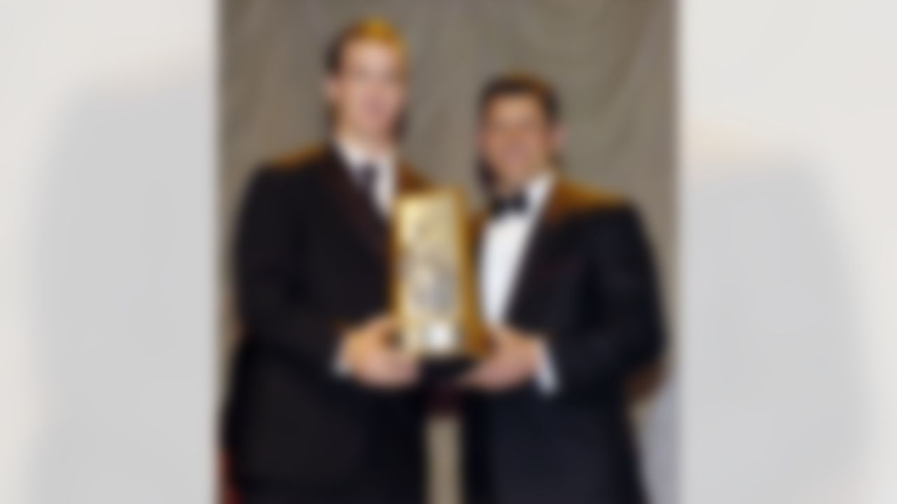 WASHINGTON - APRIL 7: NFL quarterback Peyton Manning of the Indianapolis Colts (L), poses with Washington Redskins quarterback Mark Brunell, as Manning won the Byron "Whizzer" White award during the NFL Players Gridiron Gala featuring the JB Awards, April 7, 2005, in Washington, DC. (Photo by Nick Wass/Getty Images)