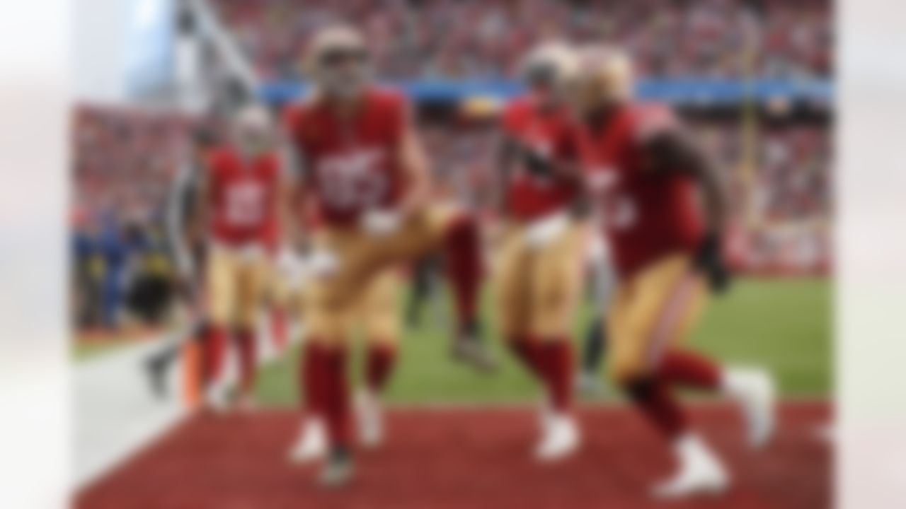 San Francisco 49ers tight end George Kittle (85) celebrates after scoring on a two point conversion during the second half of an NFL wild card playoff football game against the Seattle Seahawks in Santa Clara, Calif., Saturday, Jan. 14, 2023.