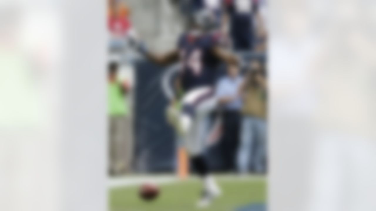 Houston Texans' Ben Tate celebrates a touchdown against the New England Patriots during the first quarter of an NFL football game Sunday, Dec. 1, 2013, in Houston. (AP Photo/Patric Schneider)