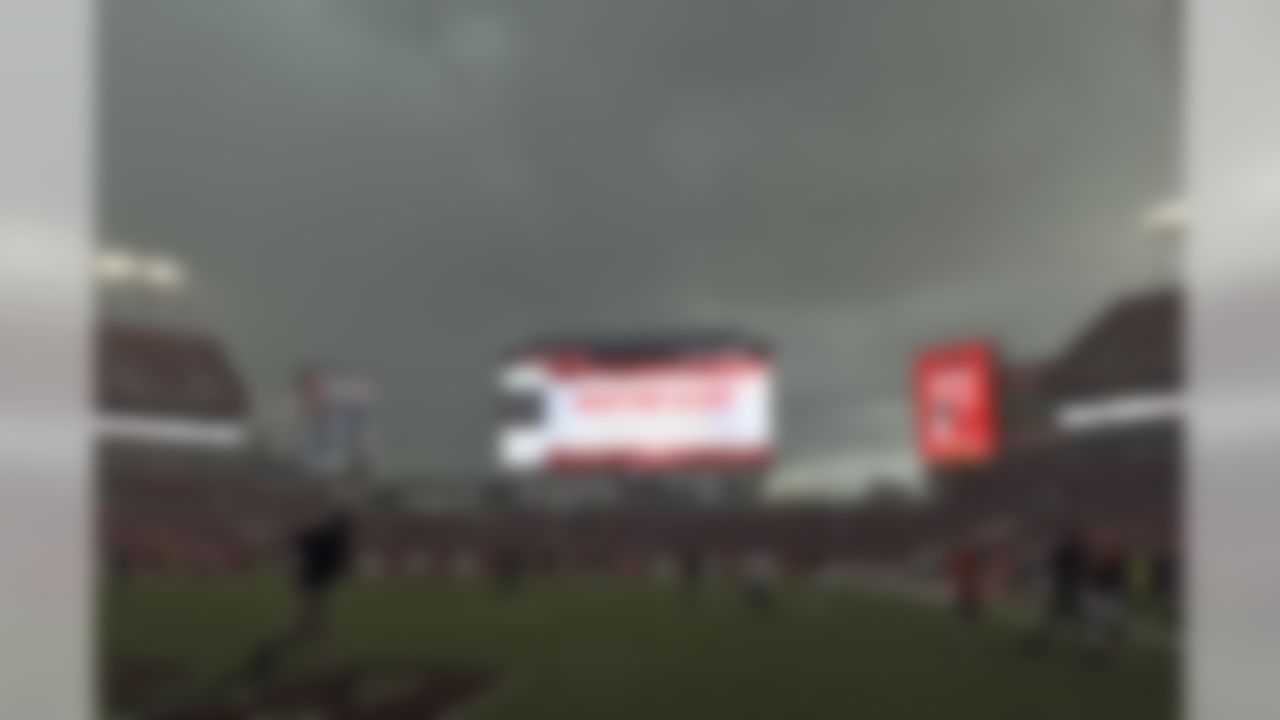 Players and coaches leave the field during a weather warning before an NFL preseason football game between the Tampa Bay Buccaneers and the Cleveland Browns Saturday, Aug. 26, 2017, in Tampa, Fla. (AP Photo/Jason Behnken)