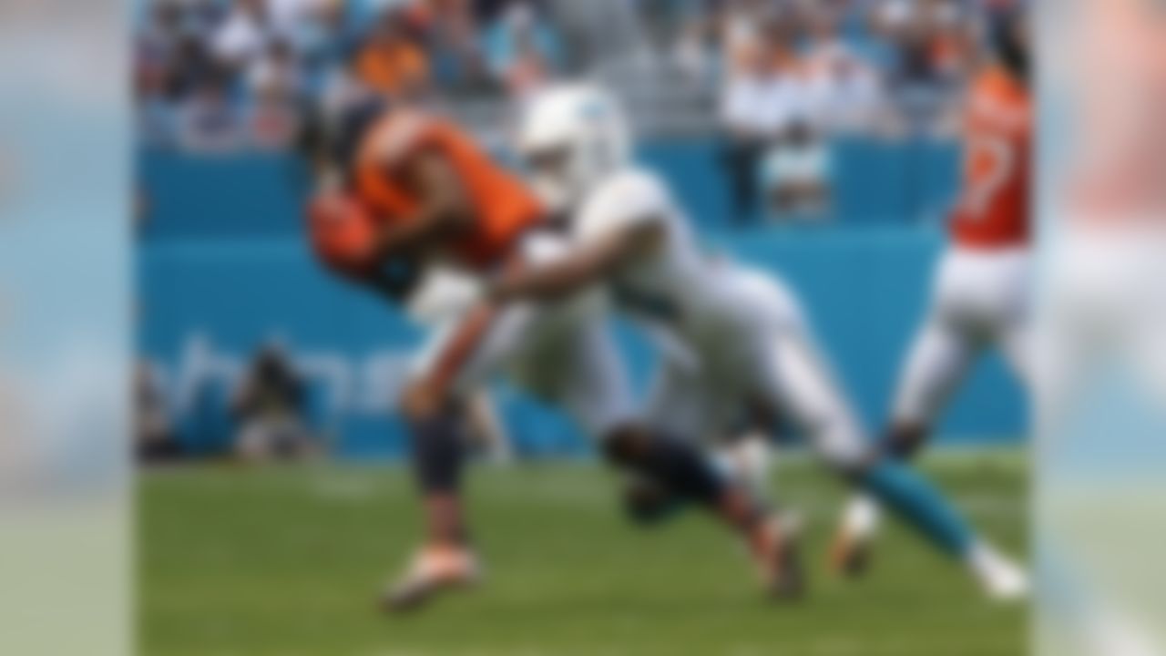 Chicago Bears wide receiver Taylor Gabriel (18) is tackled by Miami Dolphins cornerback Torry McTyer (24). during the first half of an NFL football game, Sunday, Oct. 14, 2018, in Miami Gardens, Fla. (AP Photo/Joel Auerbach)