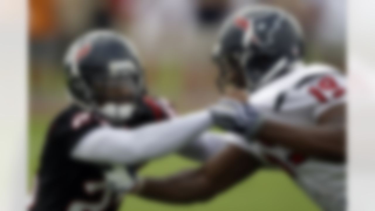 Houston Texans cornerback Kareem Jackson (25) defends against wide receiver Dorin Dickerson (19) during NFL football training camp, Saturday, July 31, 2010 in Houston. (AP Photo/David J. Phillip)