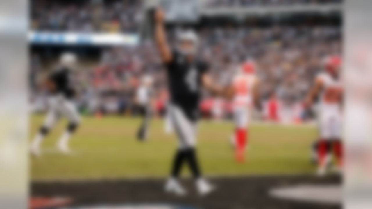Oakland Raiders quarterback Derek Carr (4) celebrates his touchdown pass during the NFL regular season game against the Kansas City Chiefs on Sunday, Dec. 6, 2015 in Oakland, Calif. (Ric Tapia/NFL)