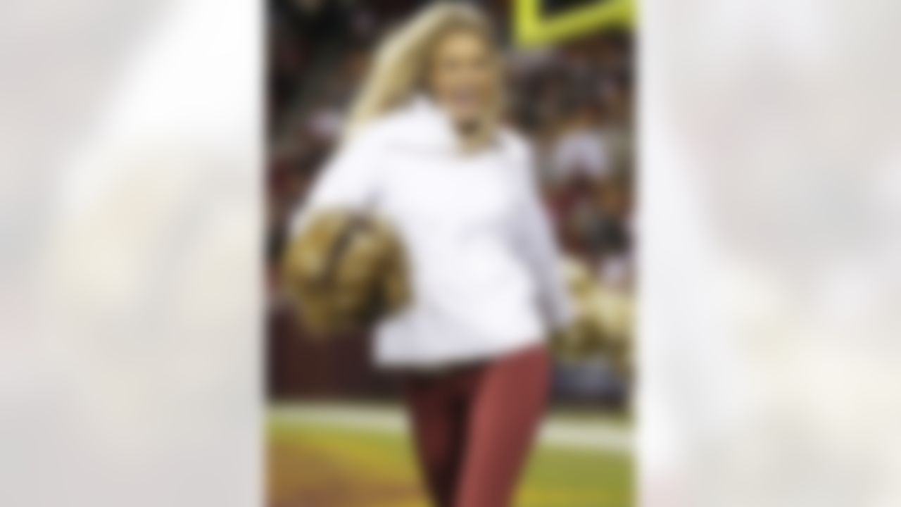 A Washington Redskins cheerleader preforms during the second half of an NFL wild card playoff football game against the Seattle Seahawks in Landover, Md., Sunday, Jan. 6, 2013. (AP Photo/Evan Vucci)