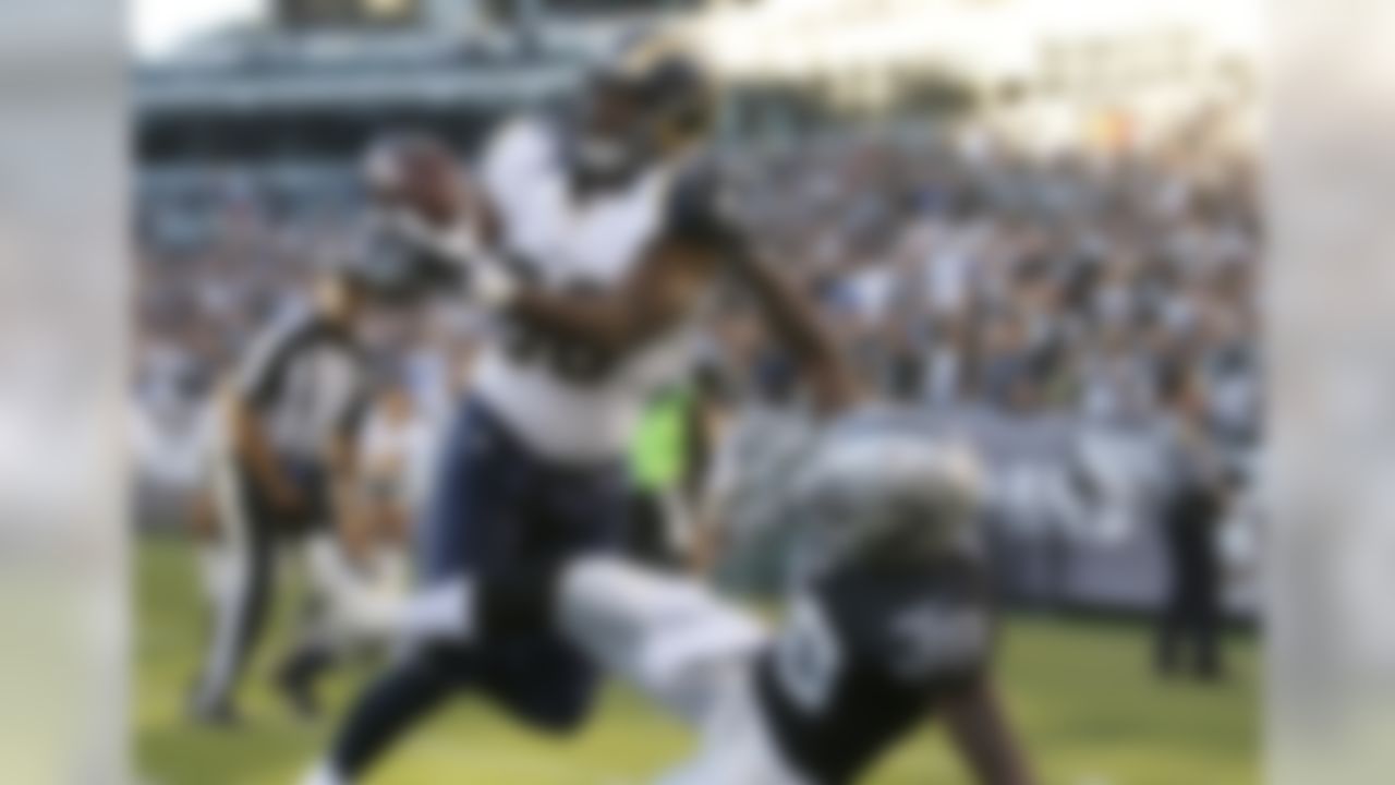 St. Louis Rams tight end Jared Cook, left, cannot make a catch as he covered by Oakland Raiders cornerback T.J. Carrie (38) during the first half of an NFL preseason football game in Oakland, Calif., Friday, Aug. 14, 2015. (AP Photo/Tony Avelar)