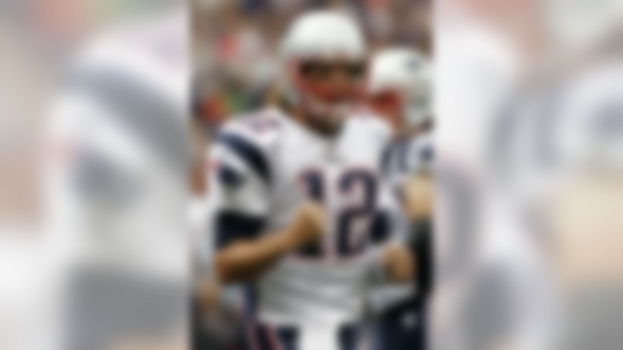 New England Patriots quarterback Tom Brady celebrates a touchdown during the first quarter of an NFL football game against the Cincinnati Bengals at Gillette Stadium in Foxborough, Mass., Sunday, Sept. 12, 2010. (AP Photo/Winslow Townson)