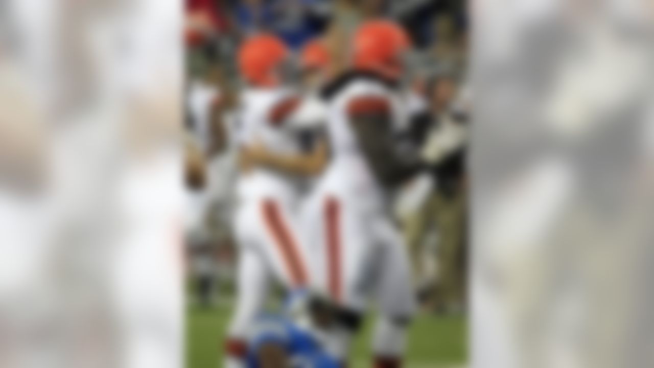 Cleveland Browns kicker Jeff Wolfert, center, is congratulated by teammate Spencer Lanning (5) after kicking the game-winning field goal during the second half of an NFL preseason football game in Detroit, Friday, Aug. 10, 2012. (AP Photo/Carlos Osorio)