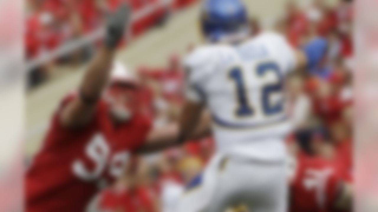 Wisconsin's J.J. Watt (99) rushes San Jose State quarterback Jordan La Secla (12) during the second half of an NCAA football game Saturday, Sept. 11, 2010, in Madison, Wis. Wisconsin won 27-14. (AP Photo/Morry Gash)