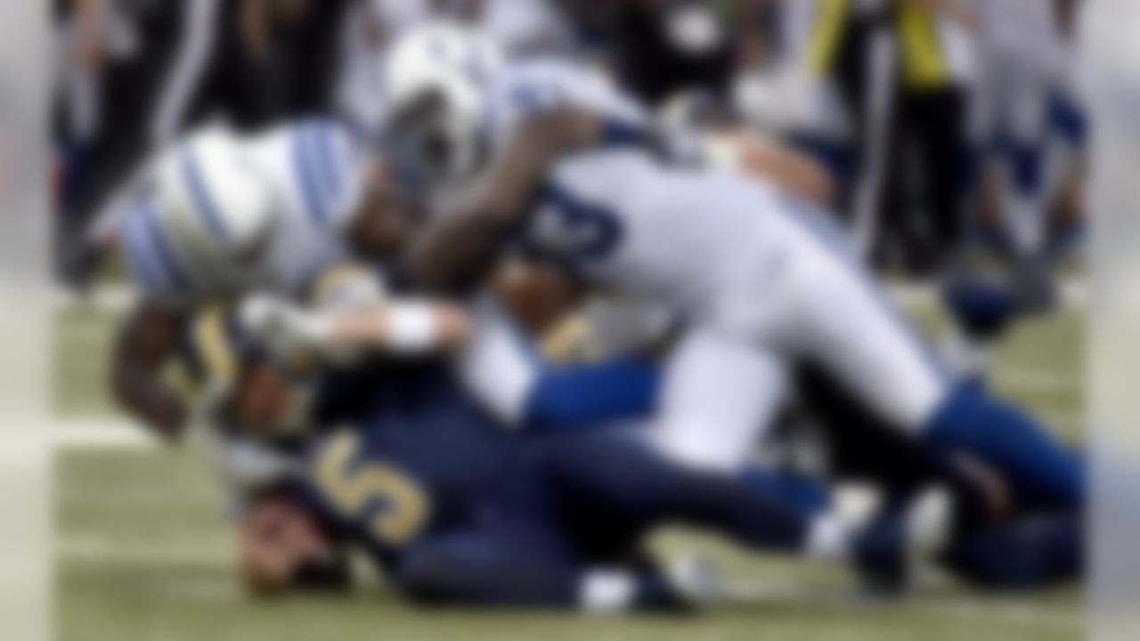 St. Louis Rams quarterback Nick Foles (5) is sacked for a 10-yard loss by Indianapolis Colts' D'Qwell Jackson, top left, and Erik Walden during the second quarter of an NFL preseason football game Saturday, Aug. 29, 2015, in St. Louis. (AP Photo/L.G. Patterson)