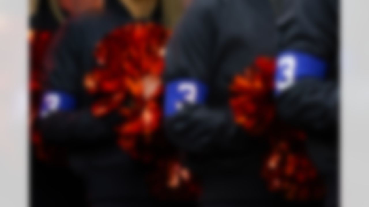 The Cincinnati Bengals cheerleaders wear wear arm bands honoring injured Buffalo Bills player Damar Hamlin as they perform in the first half of an NFL football game between the Baltimore Ravens and the Cincinnati Bengals in Cincinnati, Sunday, Jan. 8, 2023.