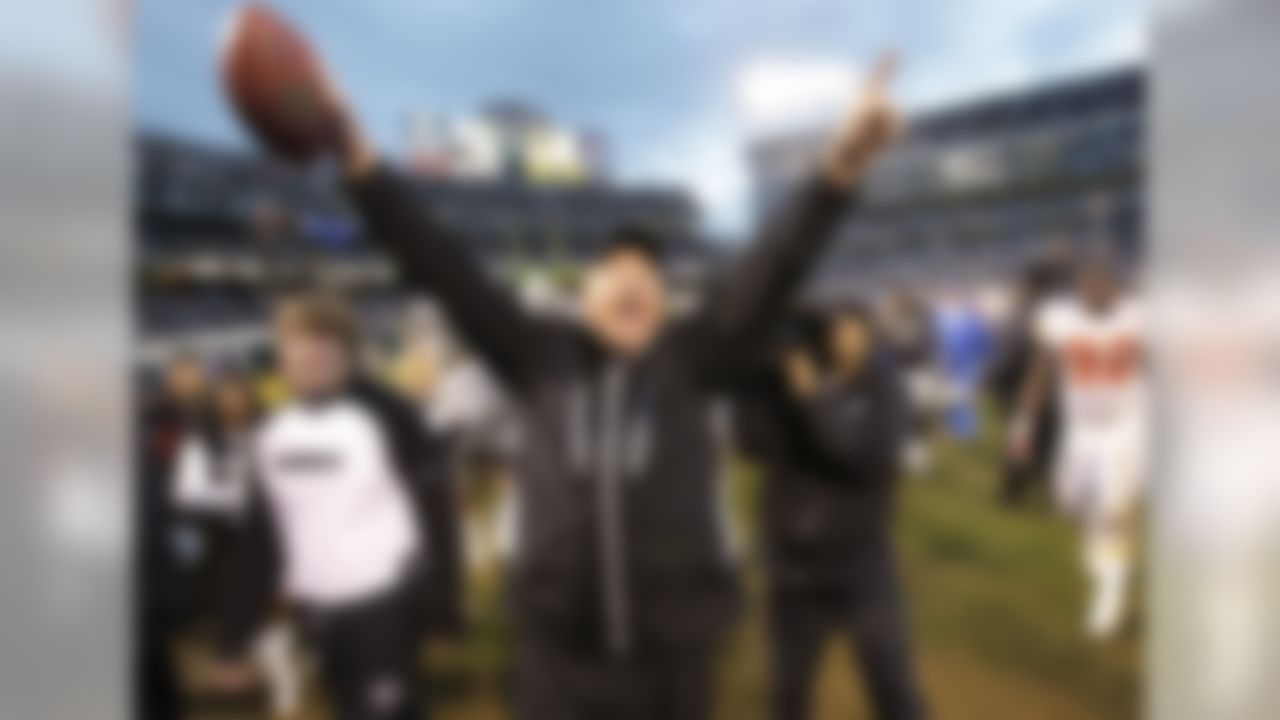 Oakland Raiders head coach Tom Cable, center, celebrates after they defeated the Kansas City Chiefs 23-20 in overtime in an NFL football game in Oakland, Calif., Sunday, Nov. 7, 2010. (AP Photo/Paul Sakuma)