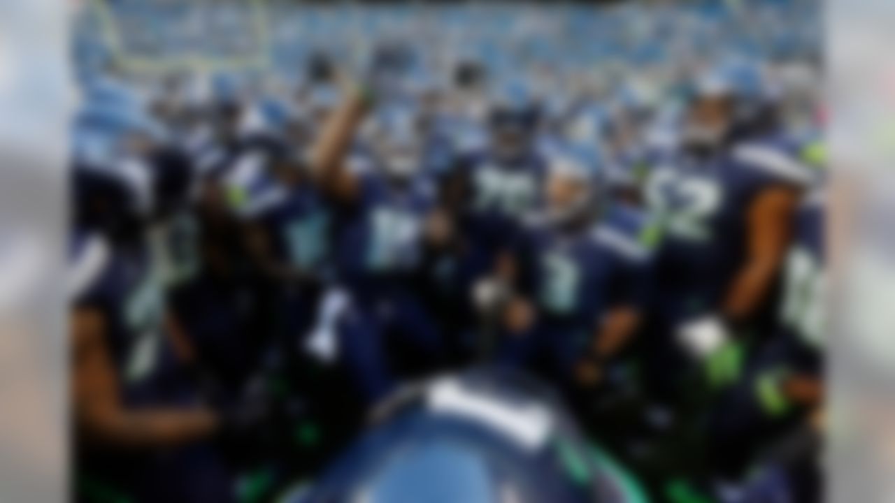 Seattle Seahawks quarterback Russell Wilson #3 gathers the players in a huddle during the NFL preseason game against the Dallas Cowboys on Thursday, Aug. 25, 2015 in Seattle. (Ric Tapia/NFL)