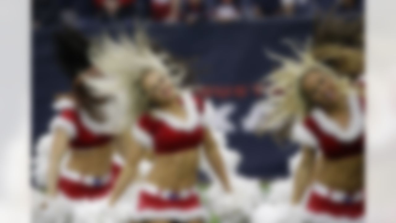The Houston Texans cheerleaders perform during the second half of an NFL football game against the Baltimore Ravens Sunday, Dec. 21, 2014, in Houston. (AP Photo/David J. Phillip)