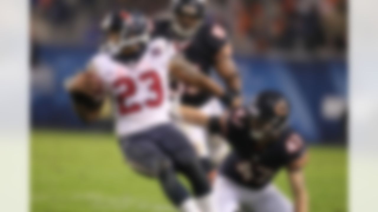 Running back Arian Foster #23 of the Houston Texans is tackled by safety Chris Conte #47 of the Chicago Bears at Soldier Field in Chicago, IL on Nov. 11, 2012 (Todd Rosenberg/NFL)