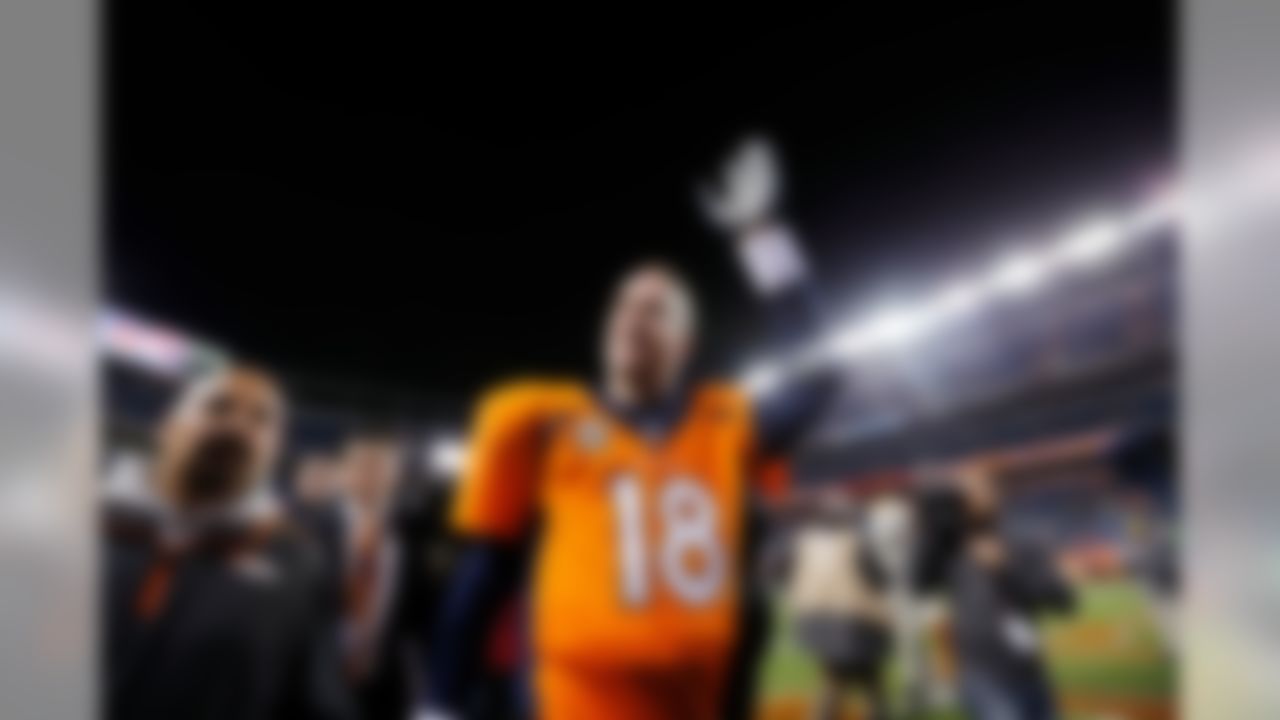 Denver Broncos quarterback Peyton Manning (18) waves to the fans after the NFL regular season game between the Kansas City Chiefs and the Denver Broncos on Nov. 17, 2013 at Sports Authority Field at Mile High in Denver. (Ric Tapia/NFL)