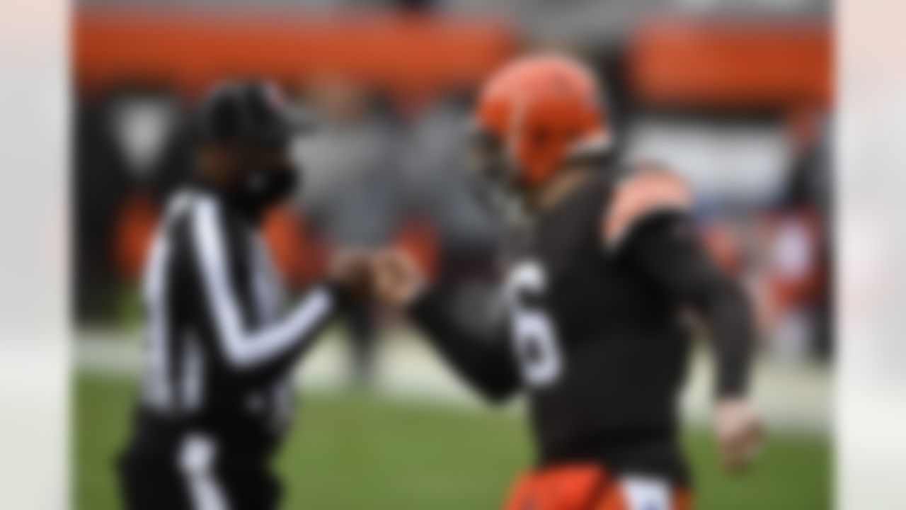 Cleveland Browns quarterback Baker Mayfield (6) fist bumps the referee during an NFL football game against the Pittsburgh Steelers on Sunday, January 3, 2021 in Cleveland, Ohio.