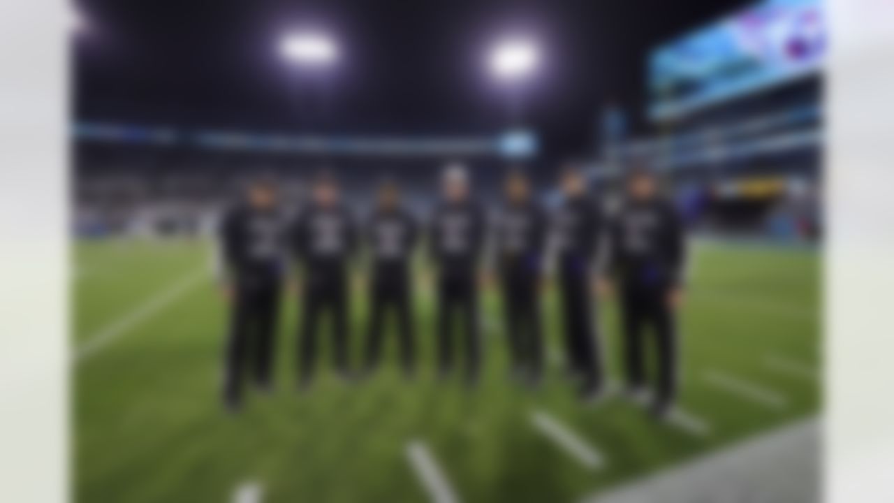 The referees pose together wearing "Love for Damar" shirts prior to an NFL football game between the Tennessee Titans and the Jacksonville Jaguars on Saturday, January 7, 2023 in Jacksonville, Florida.