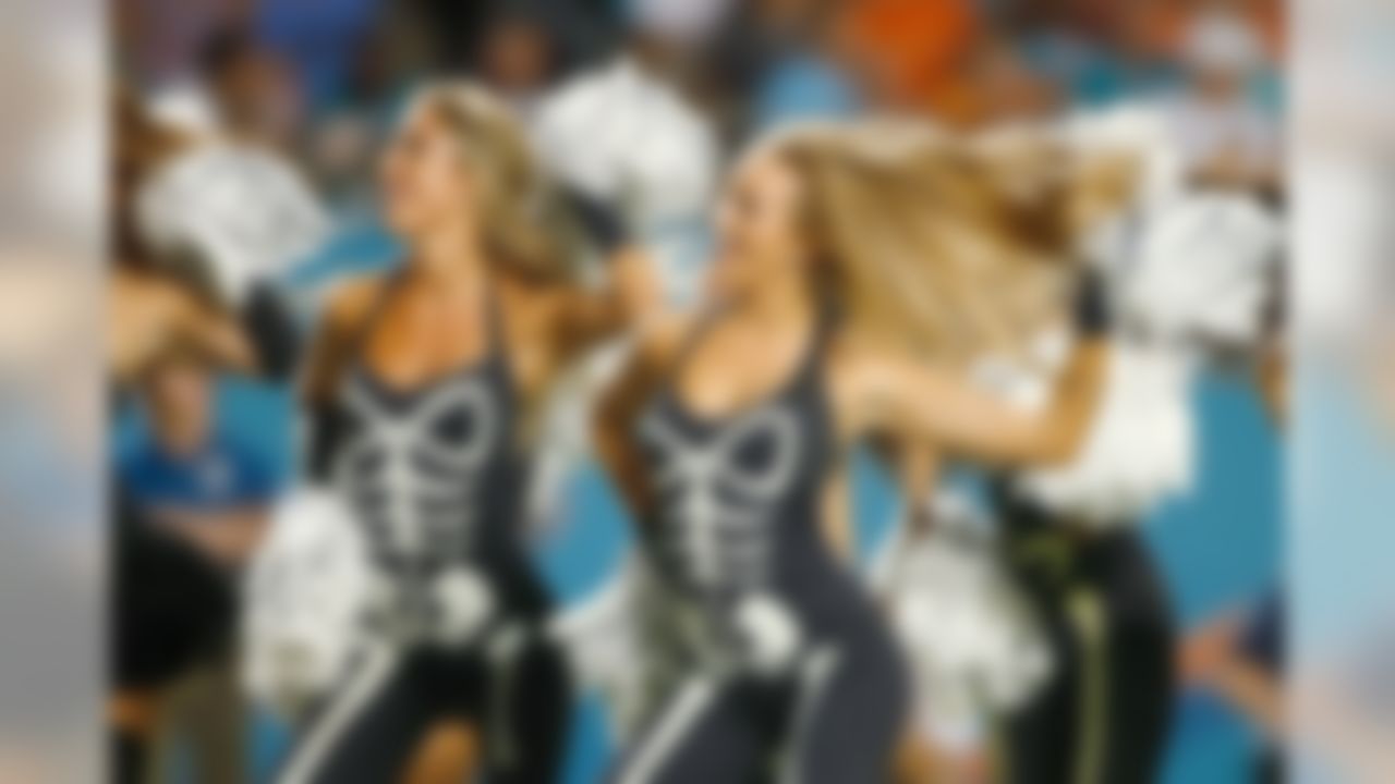 Miami Dolphins cheerleaders perform during an NFL football game against the Cincinnati Bengals at Sun Life Stadium on Sunday, Oct. 31, 2013, in Miami Gardens, Florida. The Dolphins lead the Bengals 10-3 at halftime. (Perry Knotts/NFL)