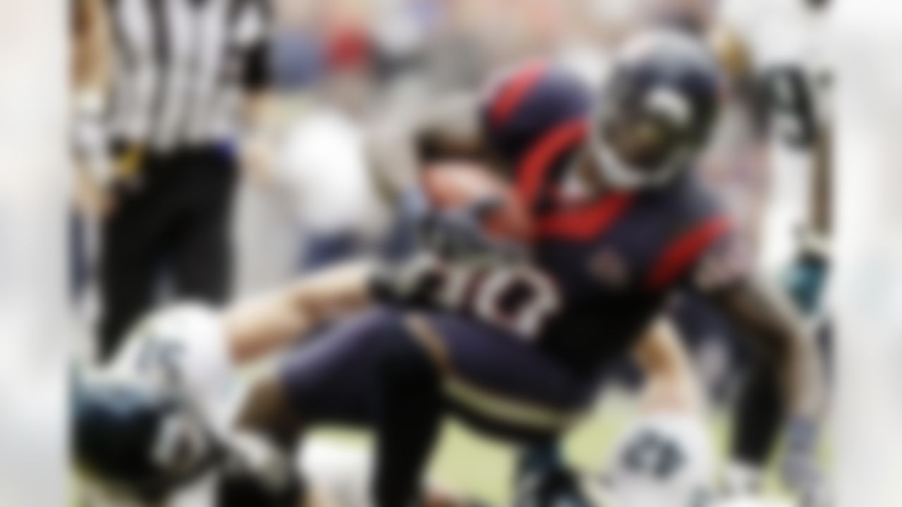 Houston Texans wide receiver Andre Johnson (80) is tackled by Jacksonville Jaguars Paul Posluszny (51) and Chris Prosinski (42) during the fourth quarter of an NFL football game, Sunday, Nov. 18, 2012, in Houston. (AP Photo/Patric Schneider)