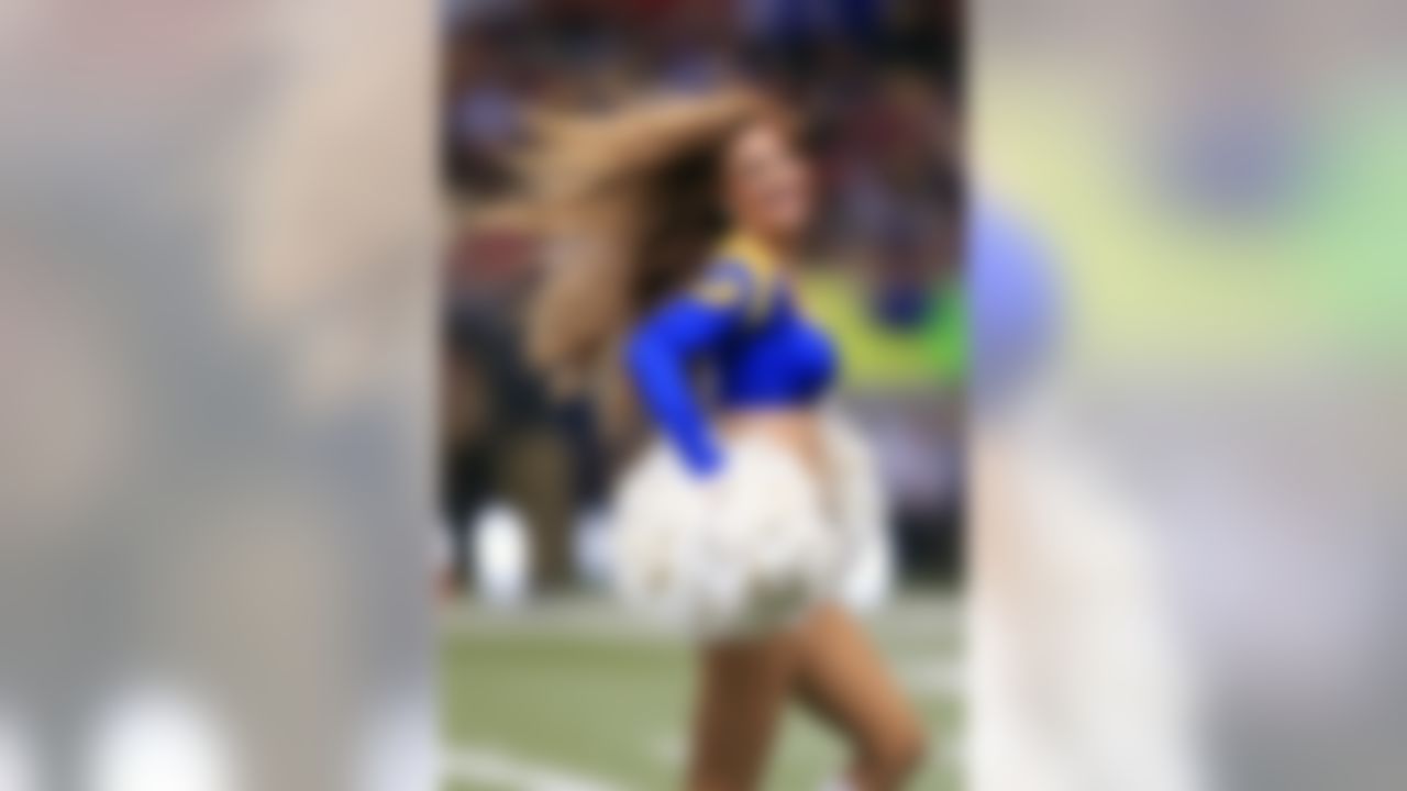 A St. Louis Rams cheerleader performs in the second quarter of an NFL football game against the San Francisco 49ers Monday, Oct. 13, 2014, in St Louis. (AP Photo/Billy Hurst)