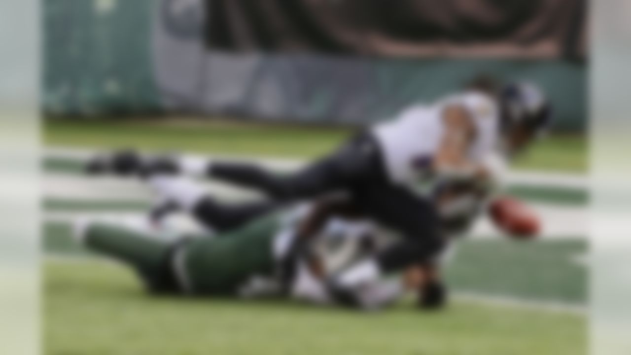 Baltimore Ravens wide receiver Chris Moore (10) bobbles the ball as he tries to recover a botched snap to New York Jets punter Lac Edwards (4) during the first quarter of an NFL football game, Sunday, Oct. 23, 2016, in East Rutherford, N.J. Moore recovered the ball in the end zone for a touchdown. (AP Photo/Frank Franklin II)