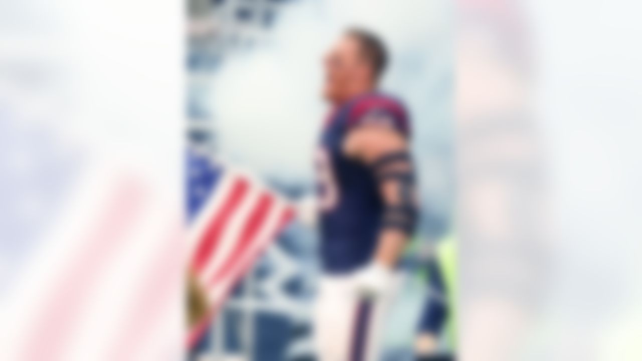 Houston Texans defensive end J.J. Watt (99) waves the American flag as he's introduced before an NFL game against the New York Jets  on November 22, 2015. The Texans defeated the Jets 24-17. (Kevin Terrell via AP)