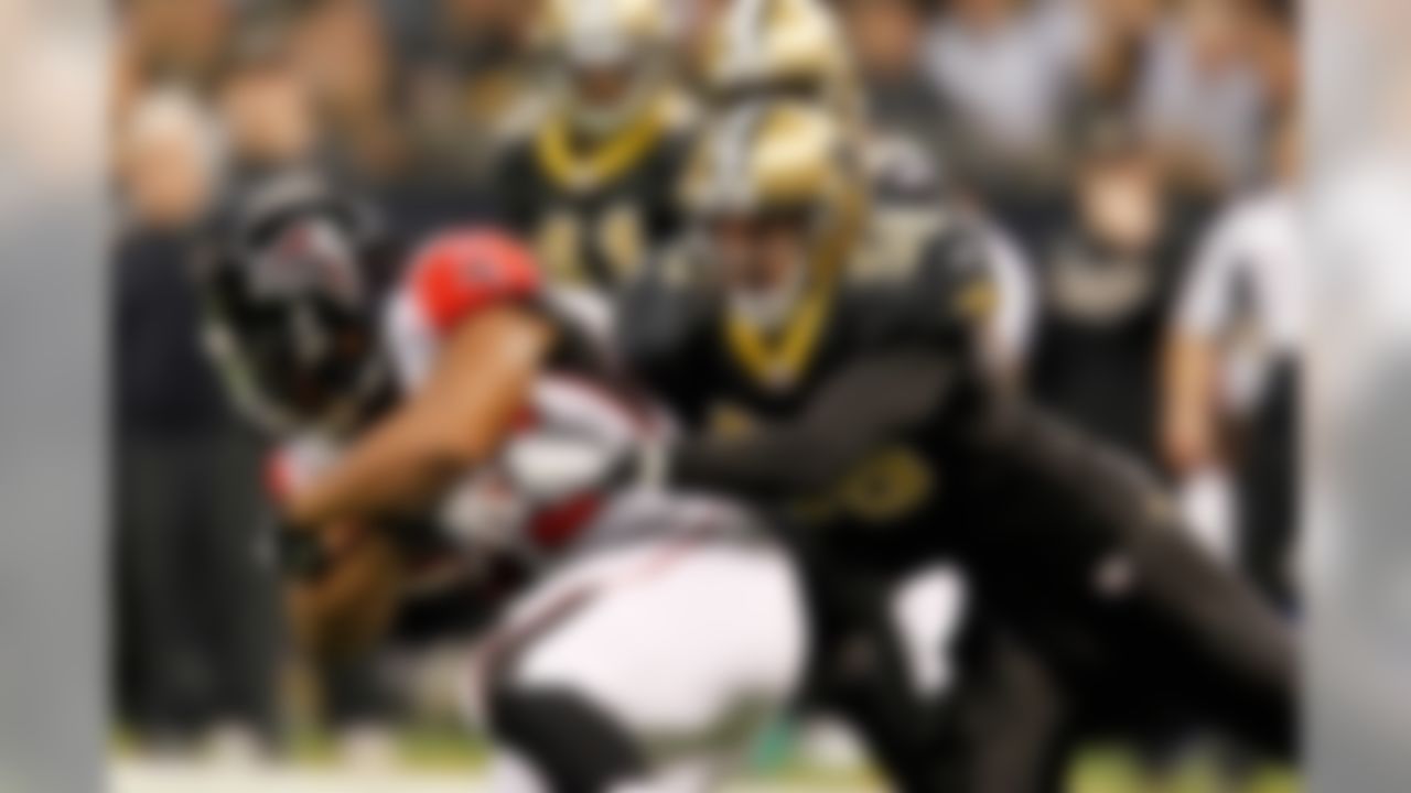 December 26, 2011; New Orleans, LA, USA; \s58] tackles Atlanta Falcons running back Michael Turner (33) during the second quarter of a game at the Mercedes-Benz Superdome. Mandatory Credit: Derick E. Hingle-US PRESSWIRE