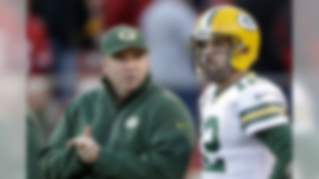 Green Bay Packers head coach Mike McCarthy talks with quarterback Aaron Rodgers (12) before an NFC divisional playoff NFL football game against the San Francisco 49ers in San Francisco, Saturday, Jan. 12, 2013. (AP Photo/Marcio Jose Sanchez)