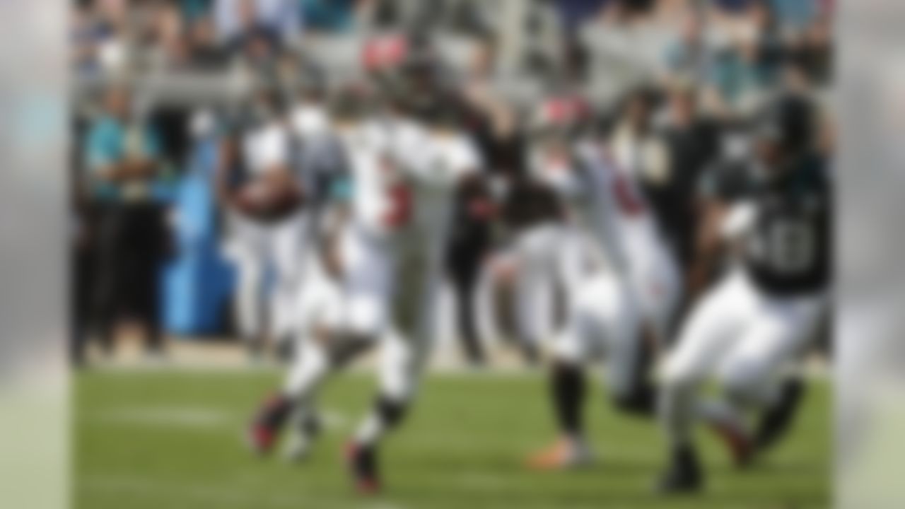 Tampa Bay Buccaneers quarterback Jameis Winston (3) looks for a receiver as he scrambles away from Jacksonville Jaguars outside linebacker Leon Jacobs (48) during the first half of an NFL football game, Sunday, Dec. 1, 2019, in Jacksonville, Fla. (AP Photo/John Raoux)